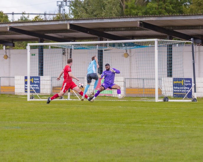 Alfie Ward scores for Woodley United. Photo: Trevor Smith.
